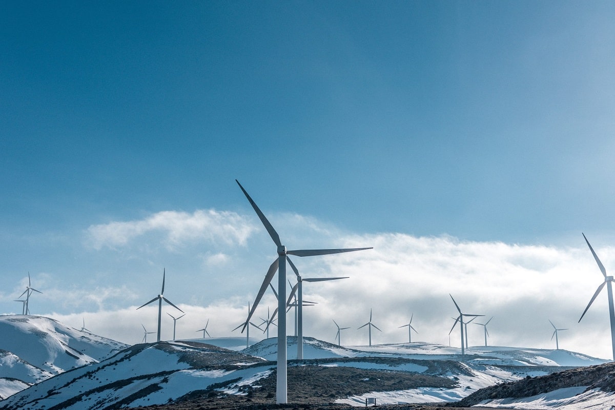 Wind turbines on hills covered with snow
